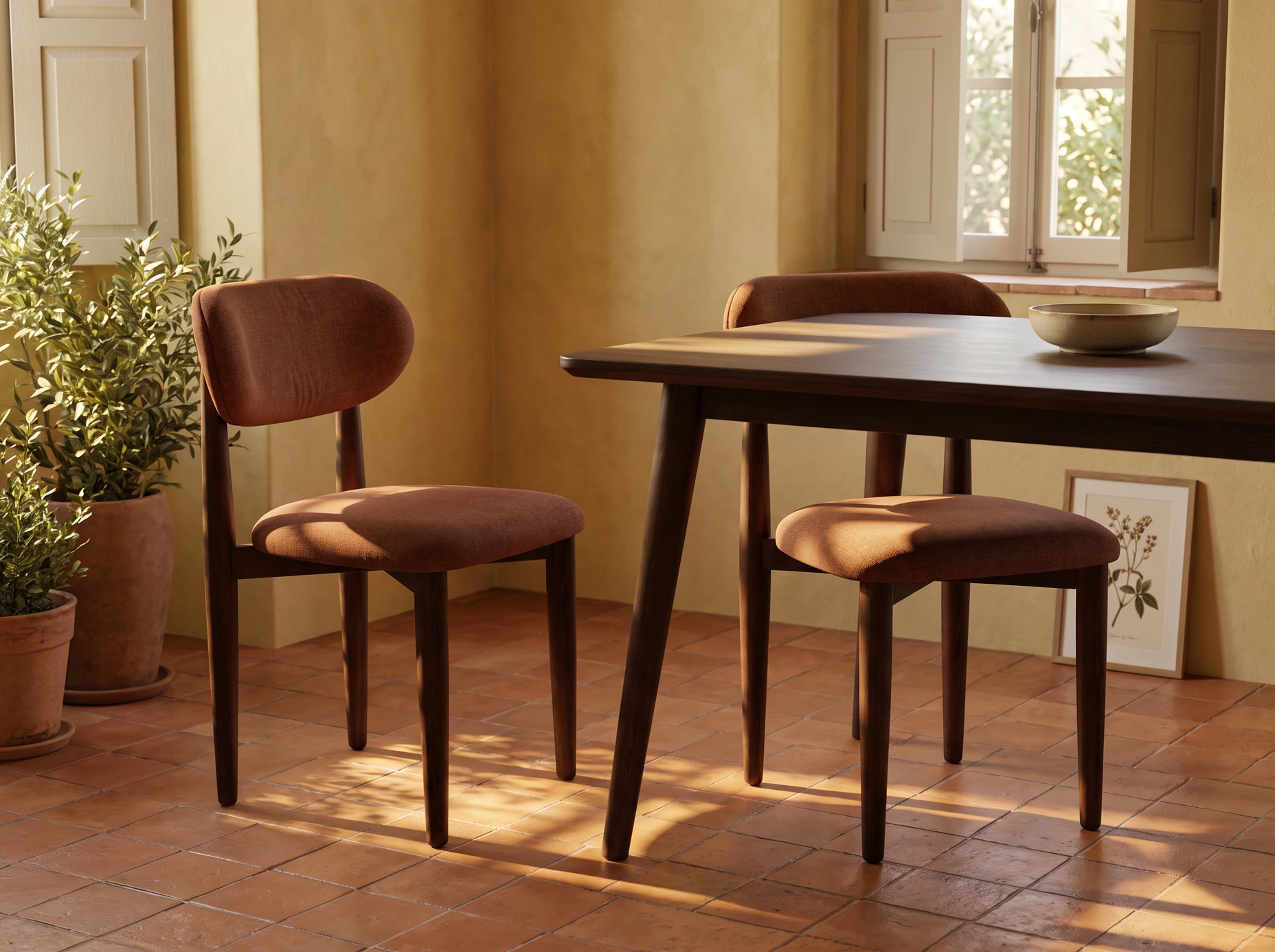 Illustration of two Arlo beech side chairs in terracotta upholstery beside a dining table