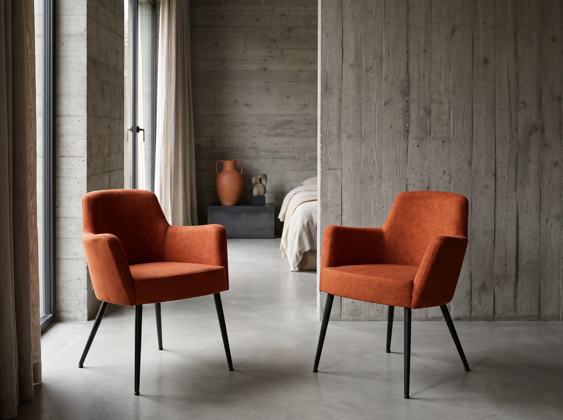 Illustration of two Milo metal armchairs in terracotta upholstery in a hotel guest room